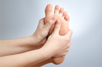 Massaging Feet With Hands For Proper Foot Care