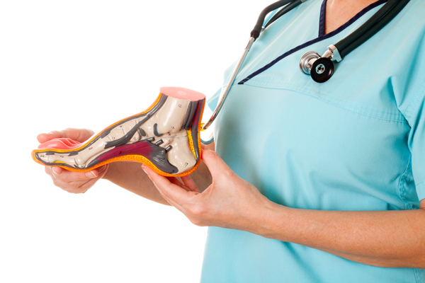 Orthopedic doctor shows the cause of flat feet